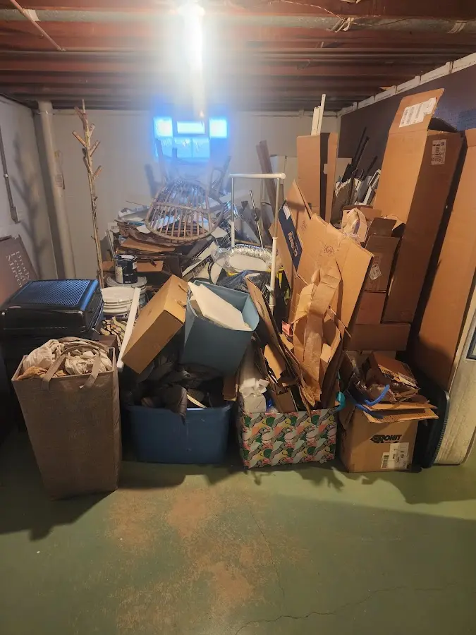 Roll-off dumpster container at job site for 2 Yard Dumpster Rental in Central Falls